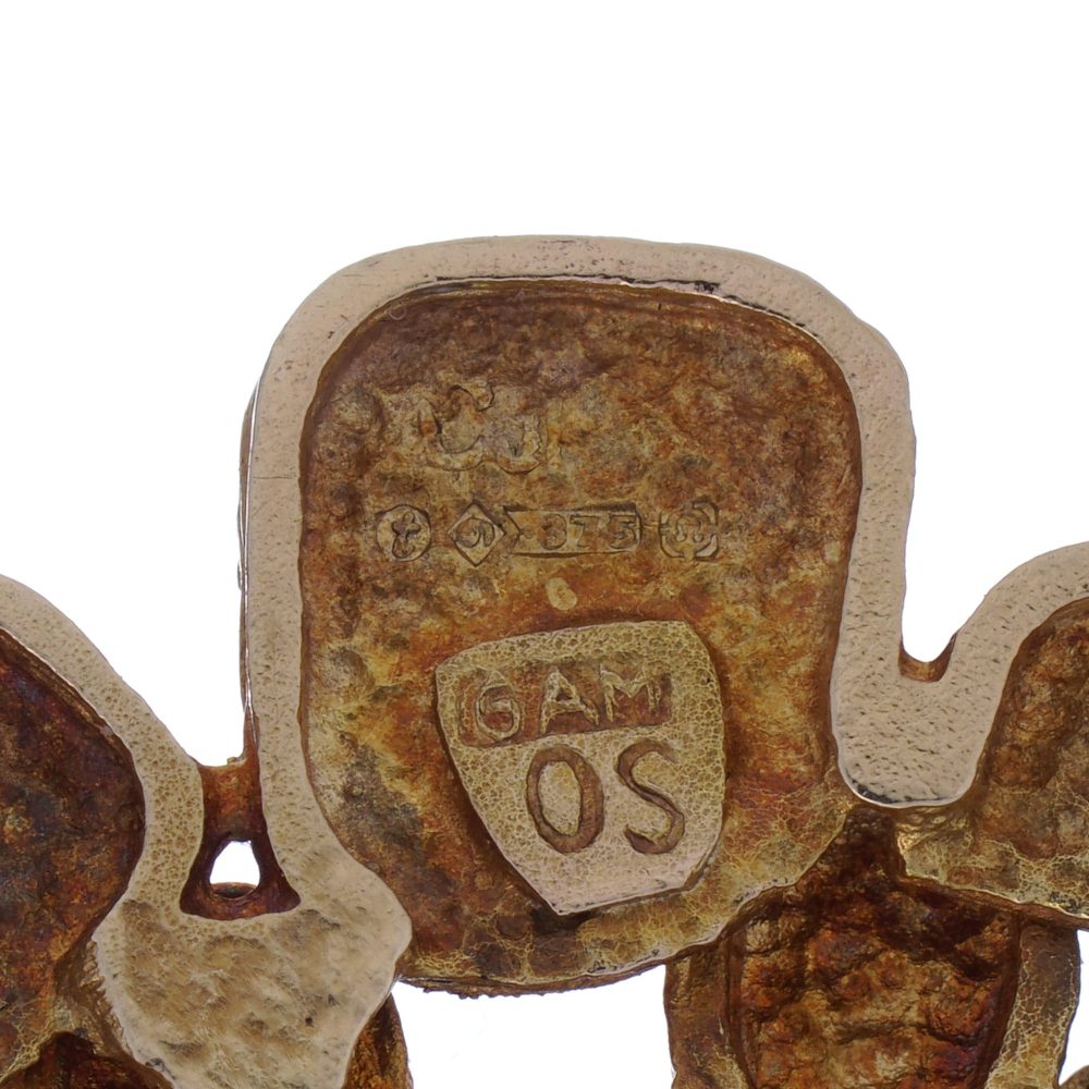 Vintage gold textured petal design diamond brooch.