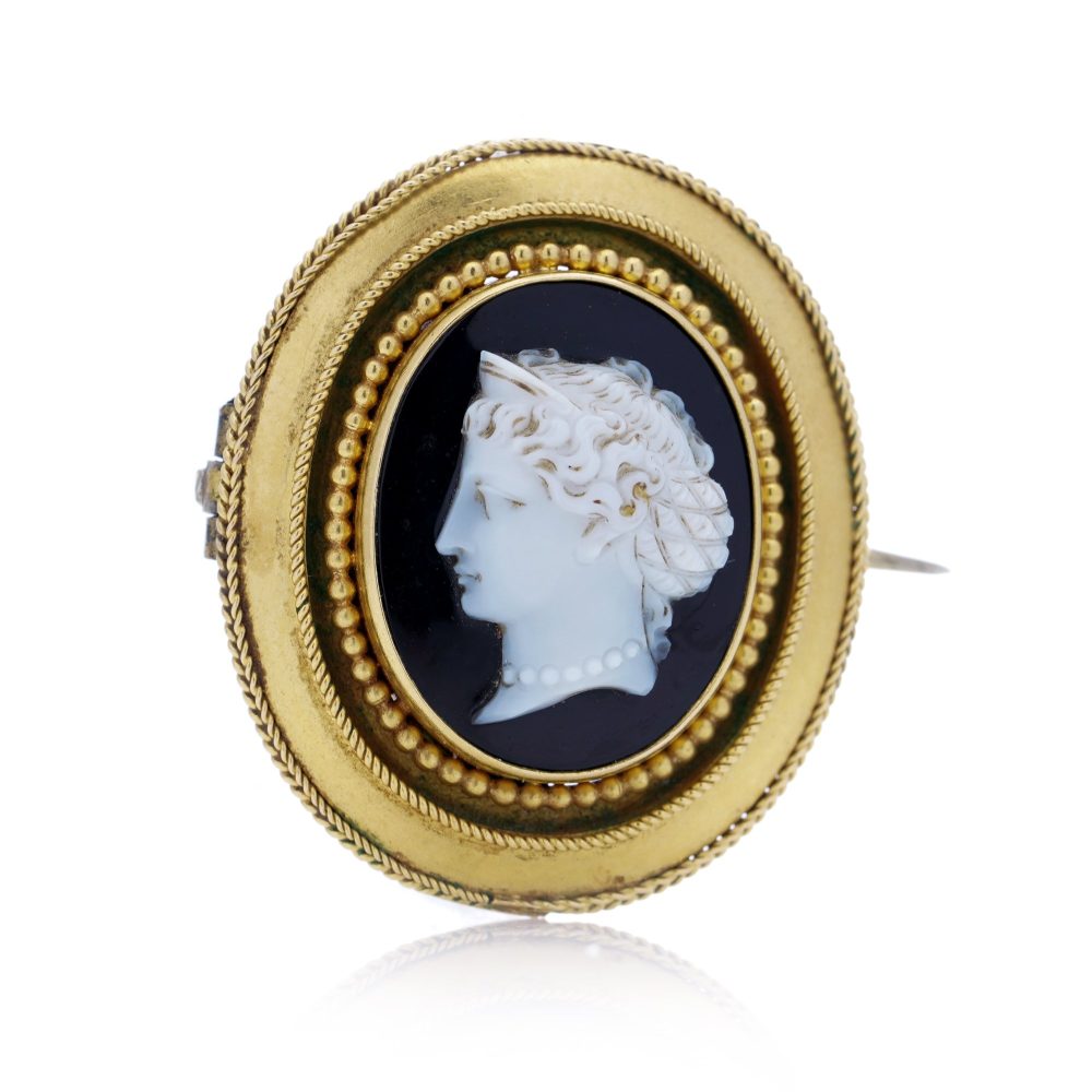 Antique gold onyx cameo brooch.