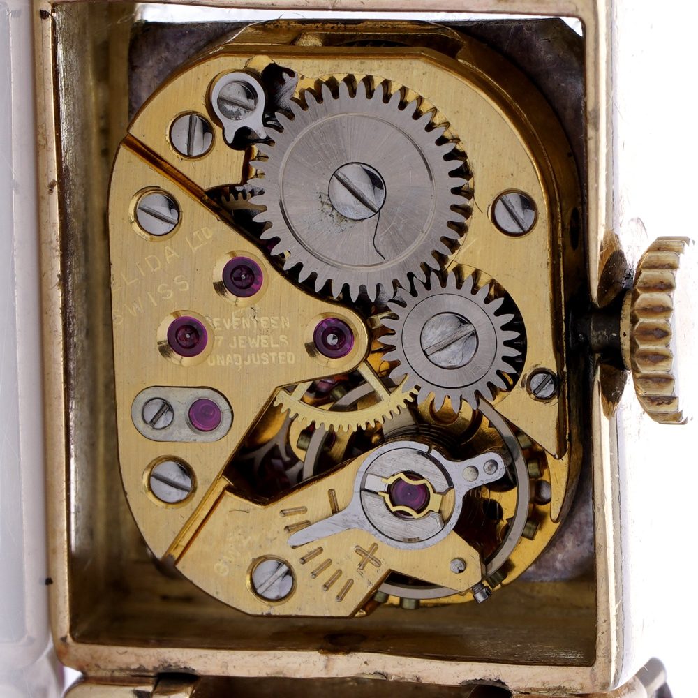 Ladies gold cocktail watch with Gemstones.