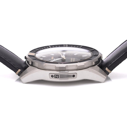 Ulysse Nardin stainless steel watch with black leather strap on a white background