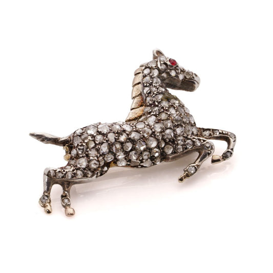 Victorian silver and gold plated horse brooch with diamonds and ruby.