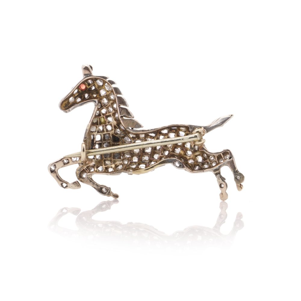Victorian silver and gold plated horse brooch with diamonds and ruby.
