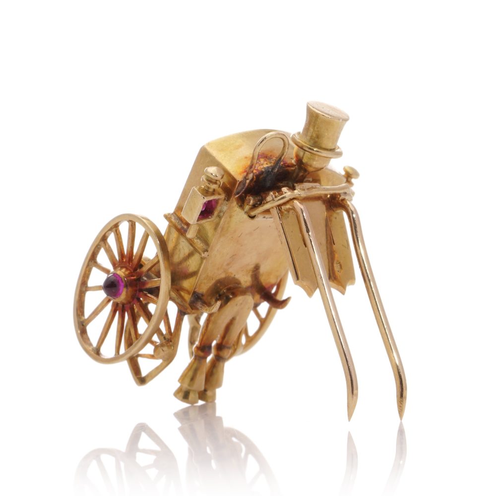 Mellerio gold sapphire and ruby carriage