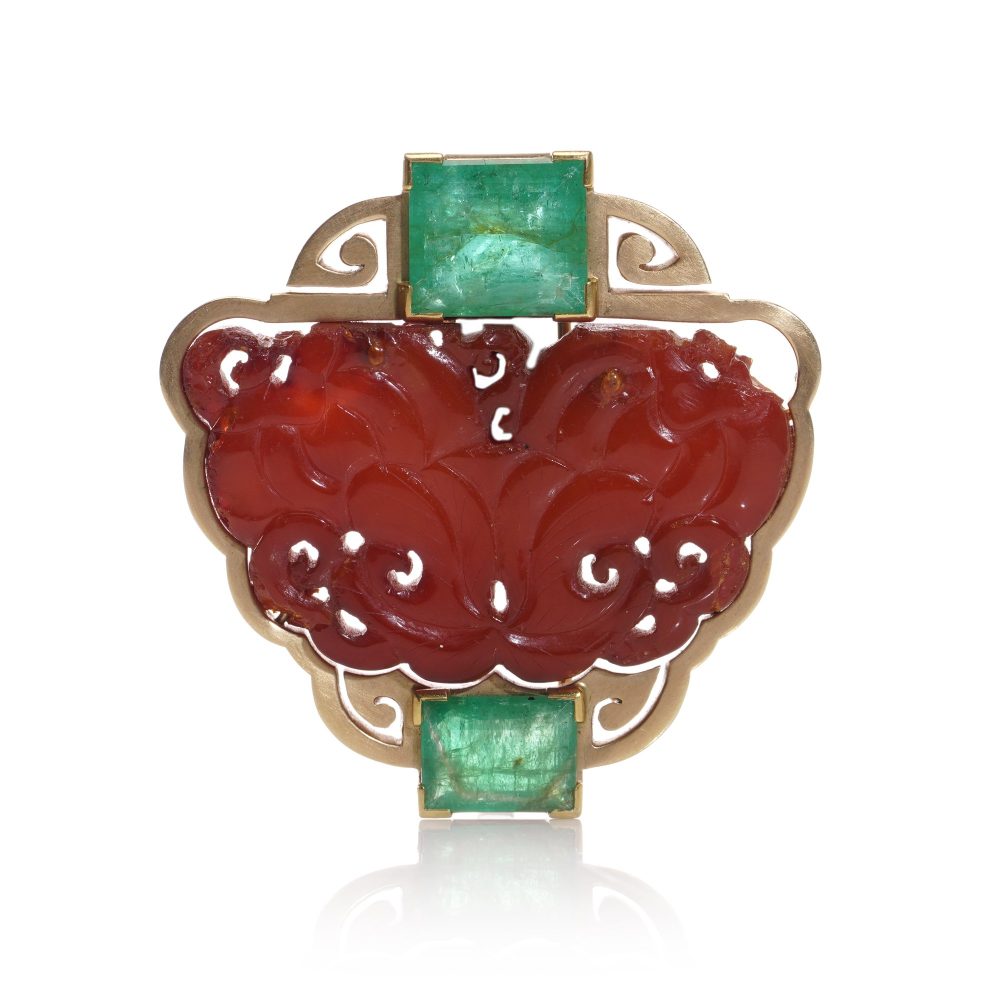 Chinese gold amber clip brooch with emeralds.