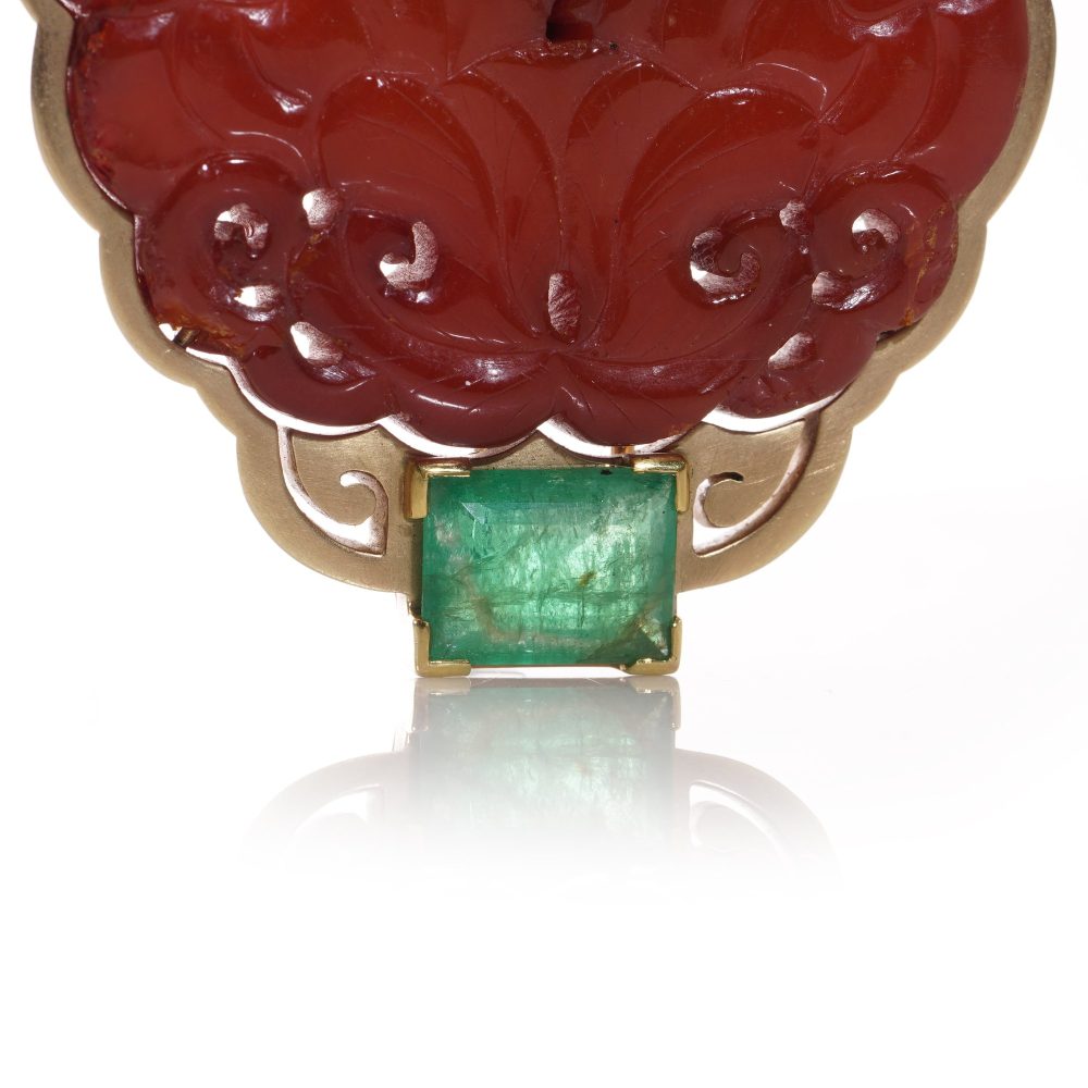 Chinese gold amber clip brooch with emeralds.