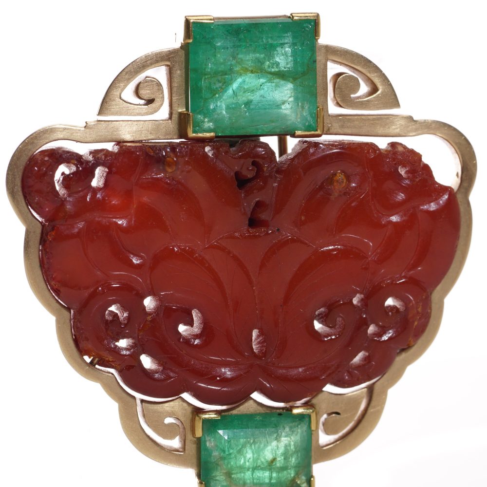 Chinese gold amber clip brooch with emeralds.