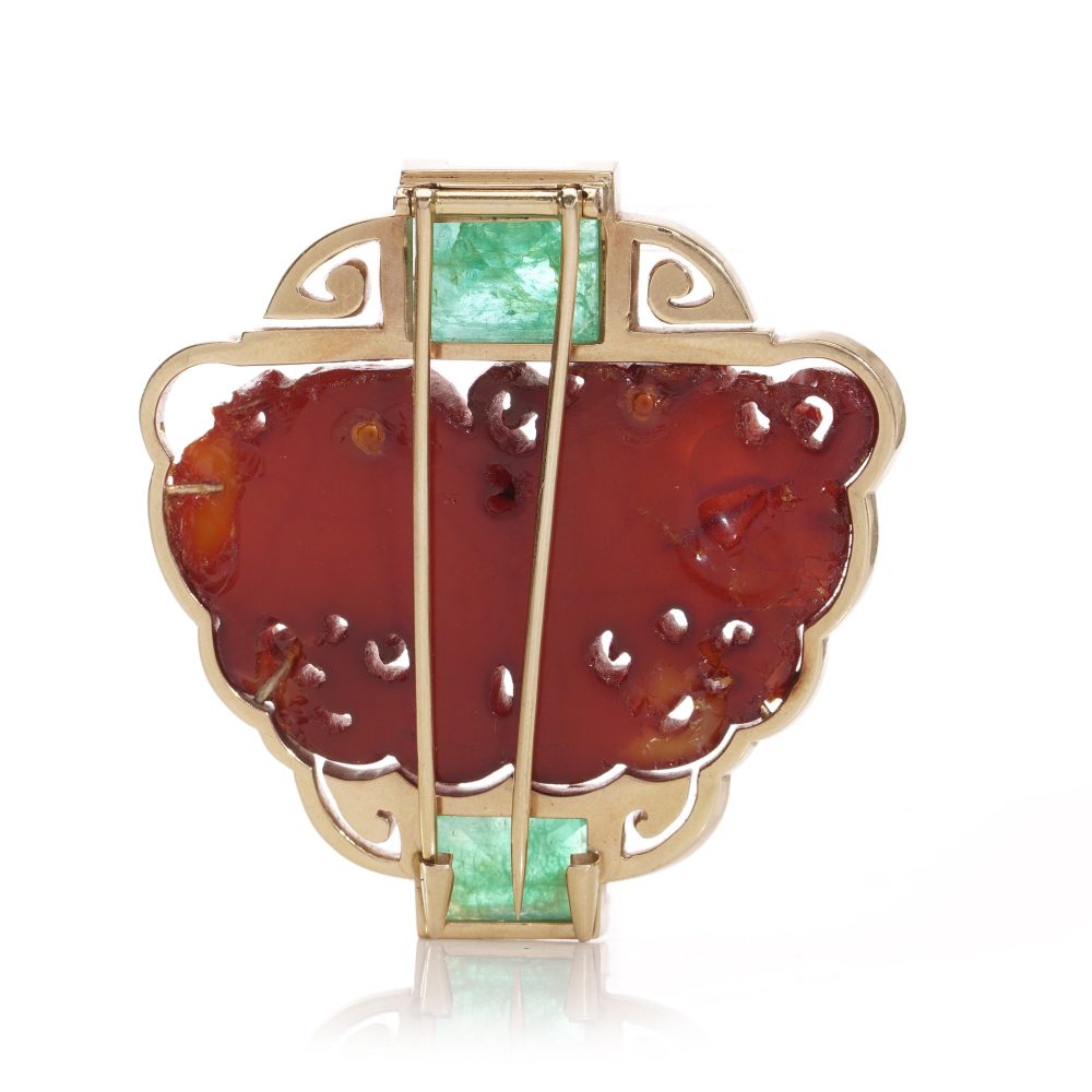 Chinese gold amber clip brooch with emeralds.