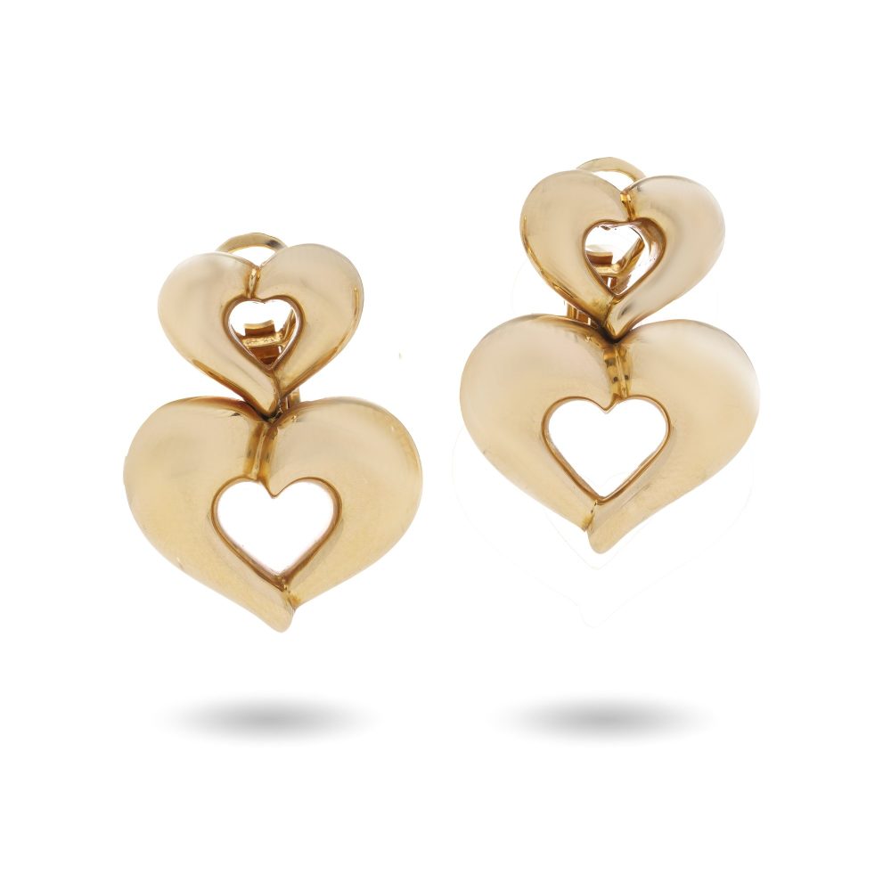 Van Cleef & Arpels clip-on earrings in gold with a heart-shaped design.