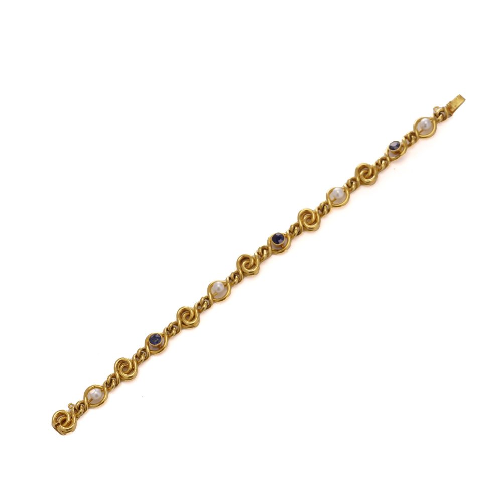 Antique sapphire and pearl bracelet in 24 carat gold.