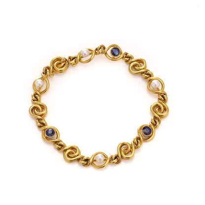 Antique sapphire and pearl bracelet in 24 carat gold.