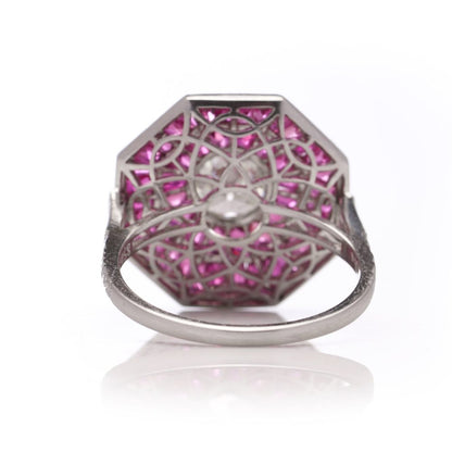 Diamond and ruby target cluster ring set in platinum made by JoAq. 