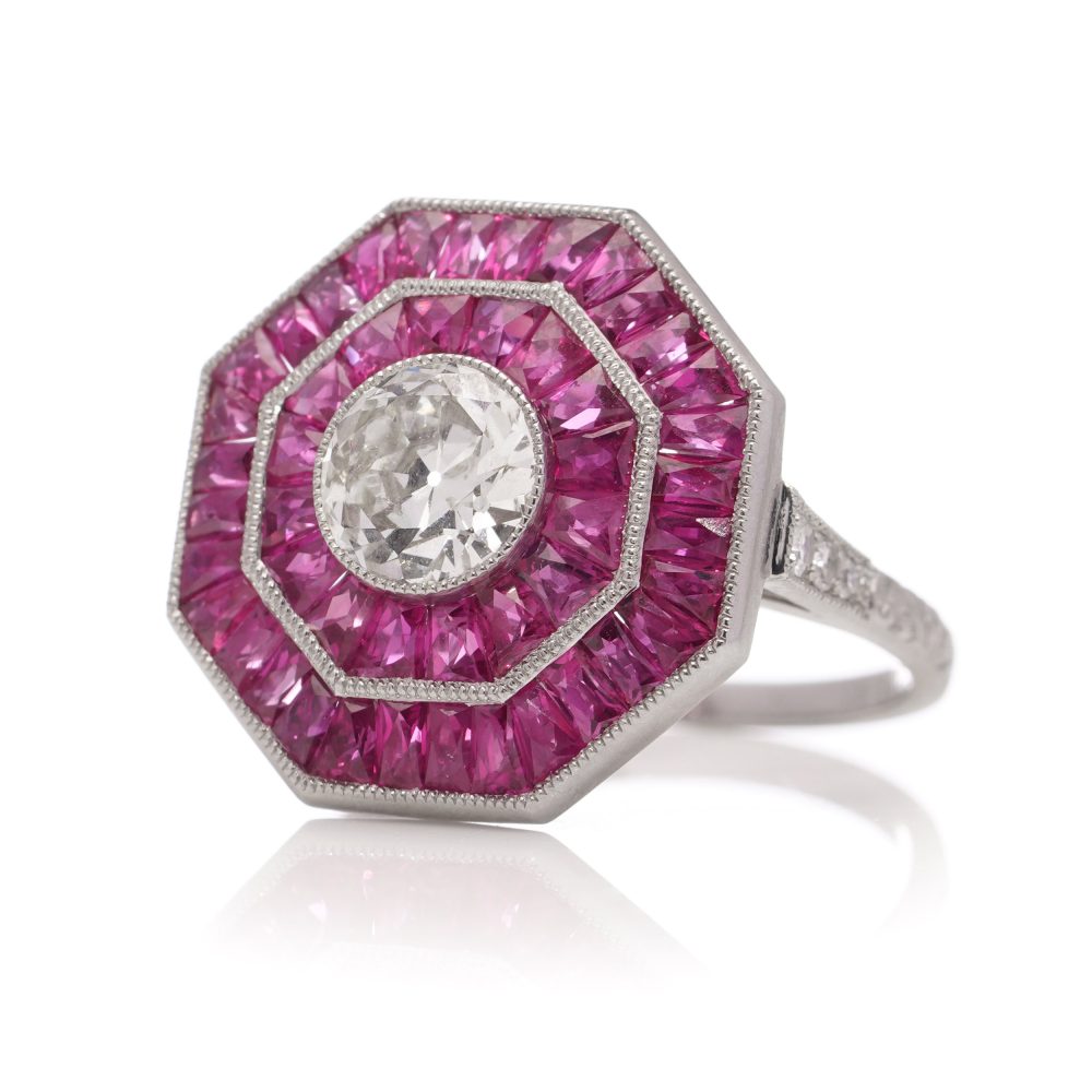 Diamond and ruby target cluster ring set in platinum made by JoAq. 