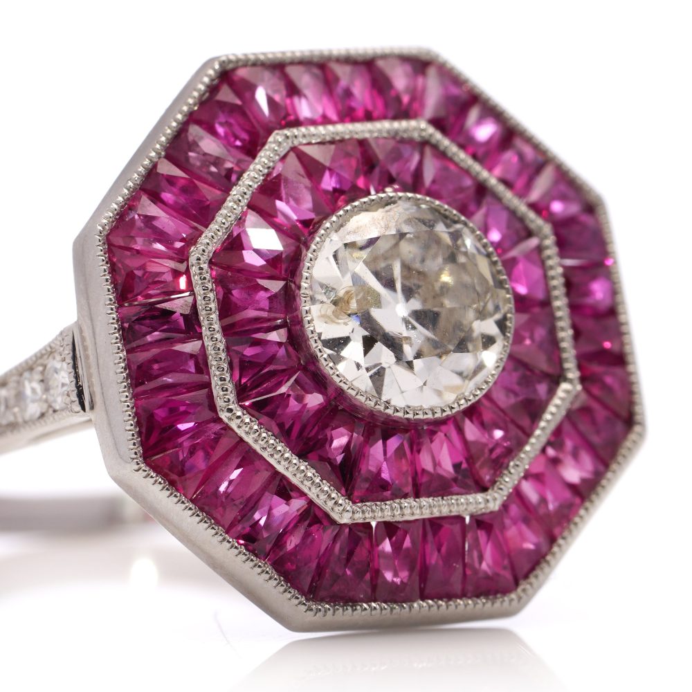 Diamond and ruby target cluster ring set in platinum made by JoAq. 