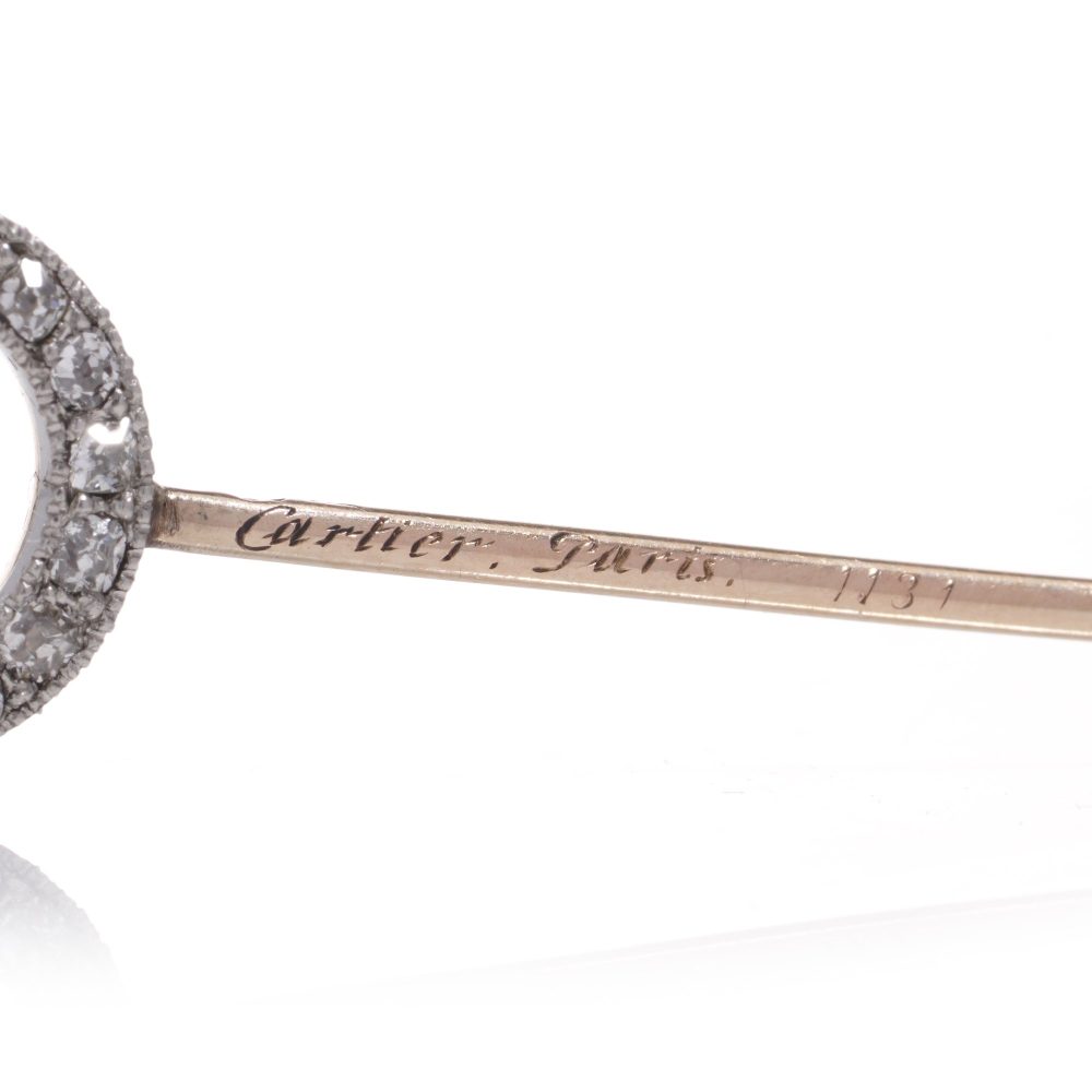 Cartier Art Deco gold and platinum ruby and diamond pin brooch.