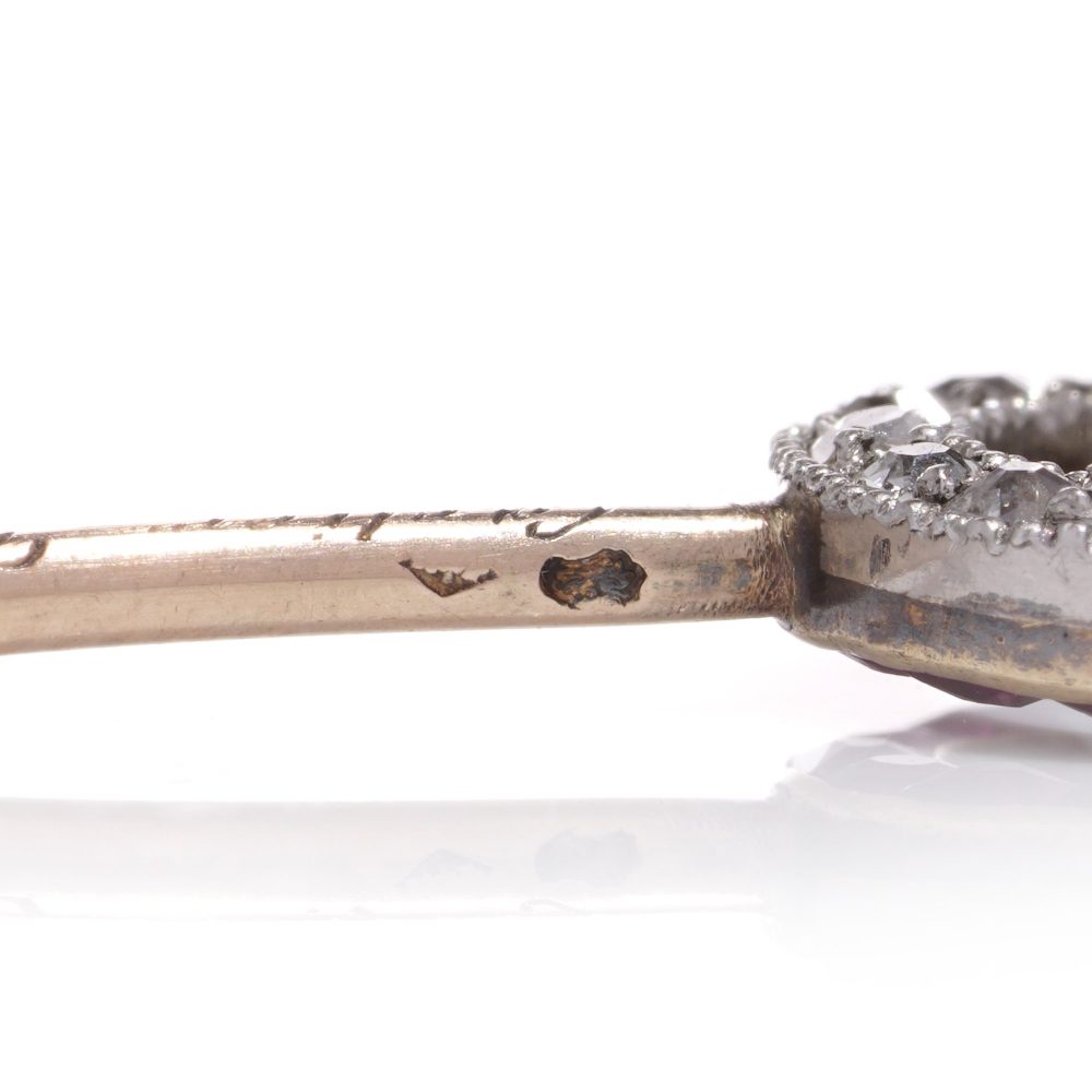 Cartier Art Deco gold and platinum ruby and diamond pin brooch.