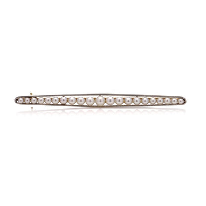 Gold and platinum elongated brooch adorned with pearls