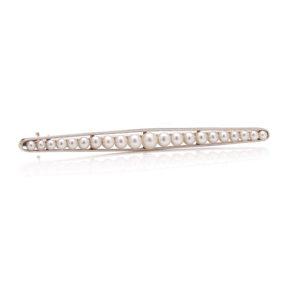 Gold and platinum elongated brooch adorned with pearls
