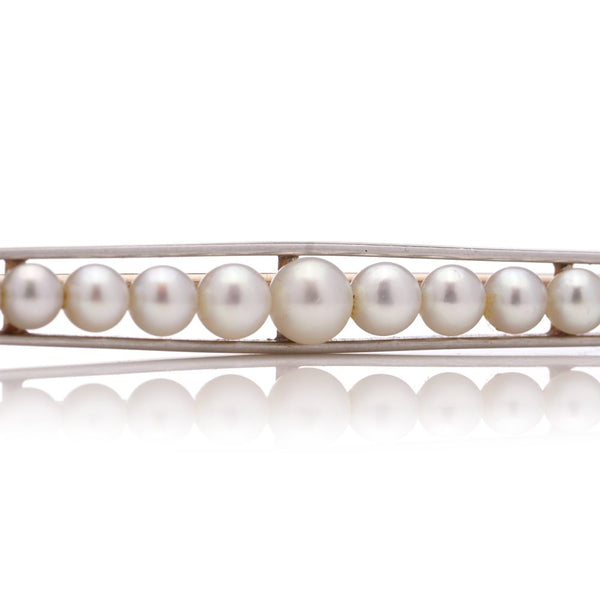 Gold and platinum elongated brooch adorned with pearls