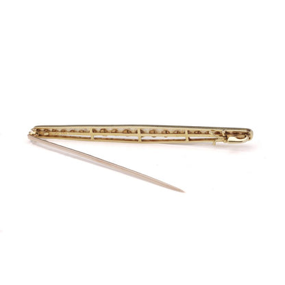 Gold and platinum elongated brooch adorned with pearls