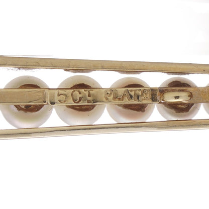 Gold and platinum elongated brooch adorned with pearls