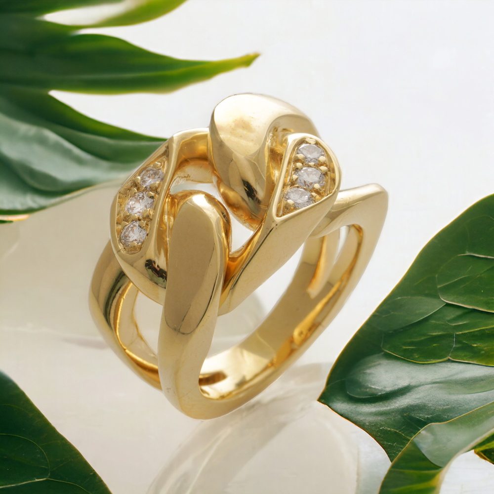 Curb link band ring 18 ct gold set with diamonds.