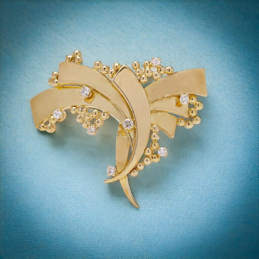 Vintage AMG abstract 18 carat yellow gold and diamond brooch.