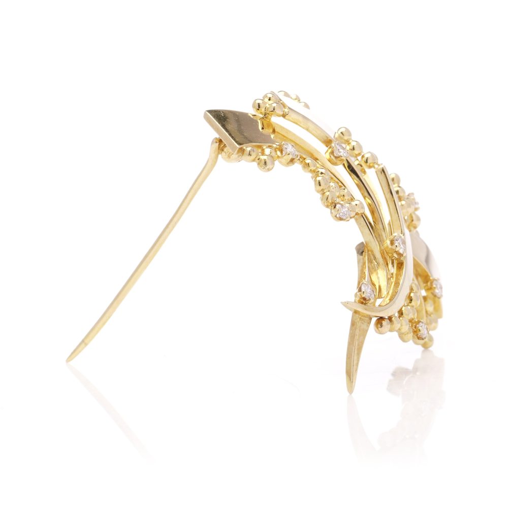 Vintage AMG abstract 18 carat yellow gold and diamond brooch.