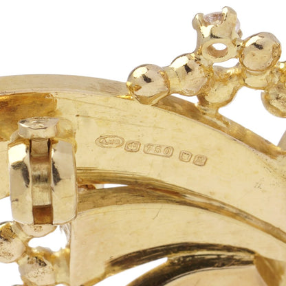 Vintage AMG abstract 18 carat yellow gold and diamond brooch.