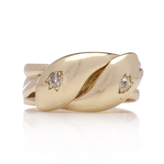 Antique gold men's snake ring set with two diamonds.