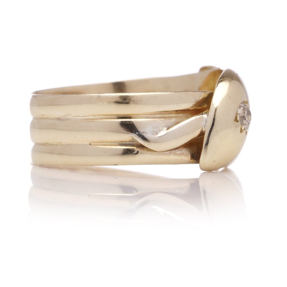 Antique gold men's snake ring set with two diamonds.