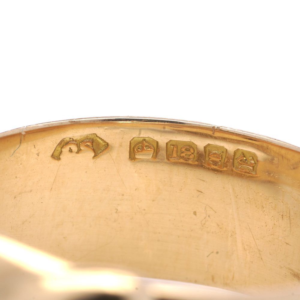 Antique gold men's snake ring set with two diamonds.