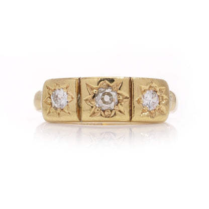 Vintage three-stone diamond ring in gold.