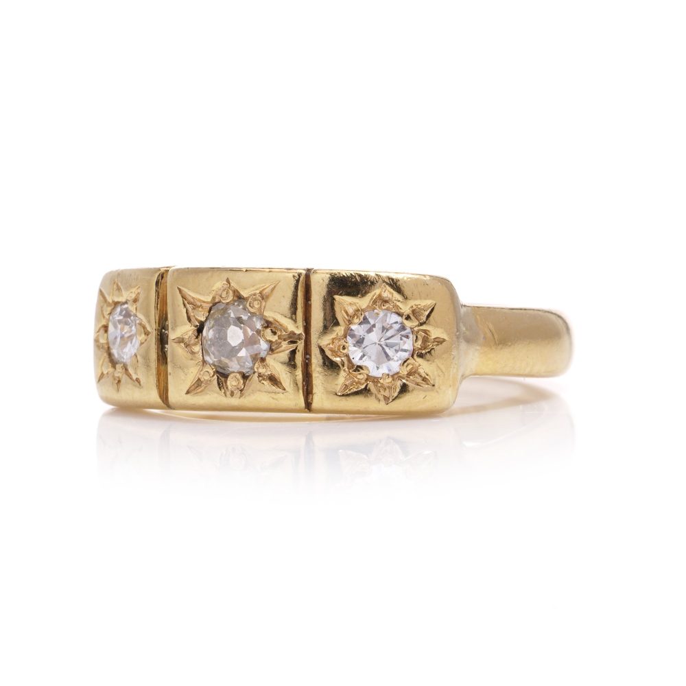 Vintage three-stone diamond ring in gold.