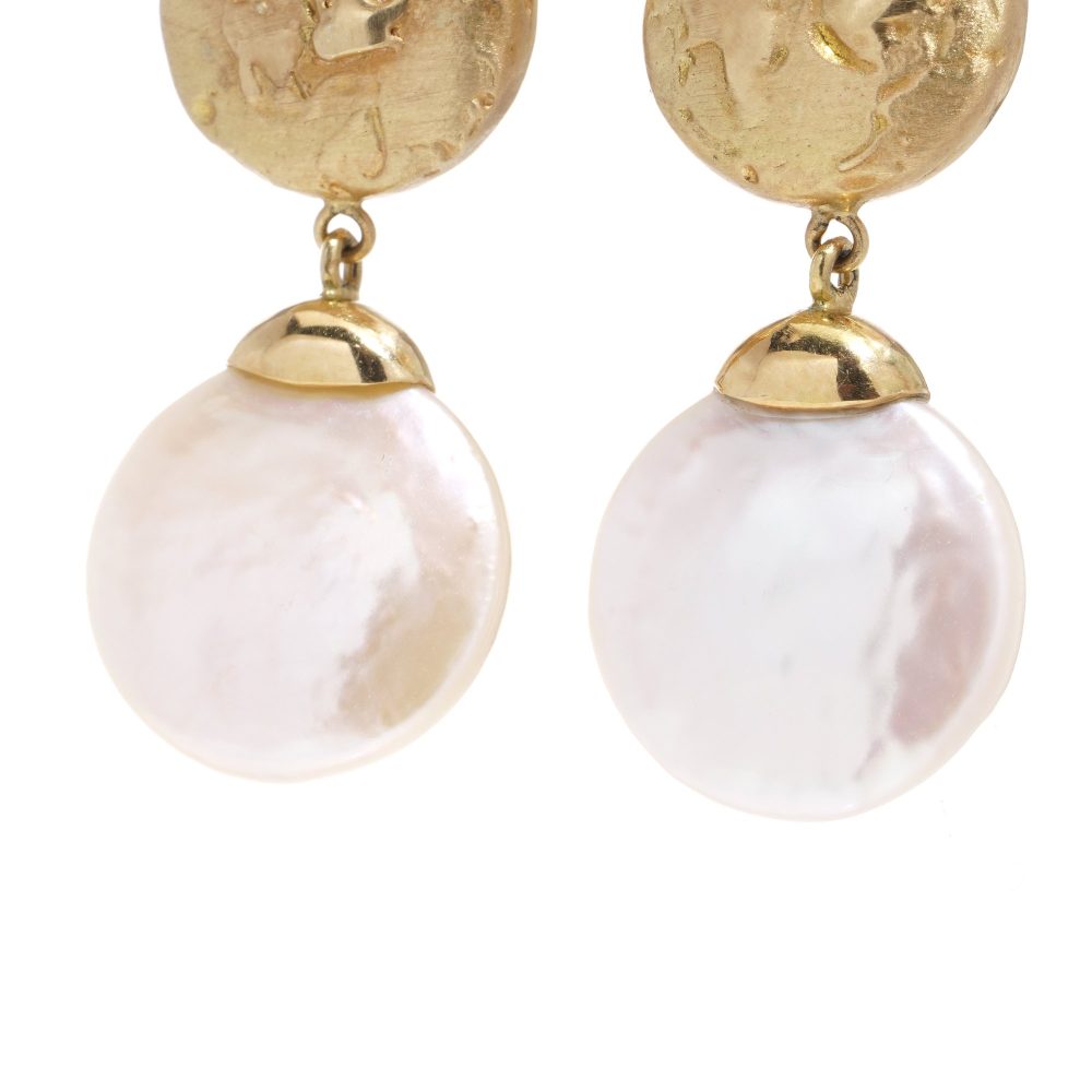Freshwater pearl drop earrings in gold.