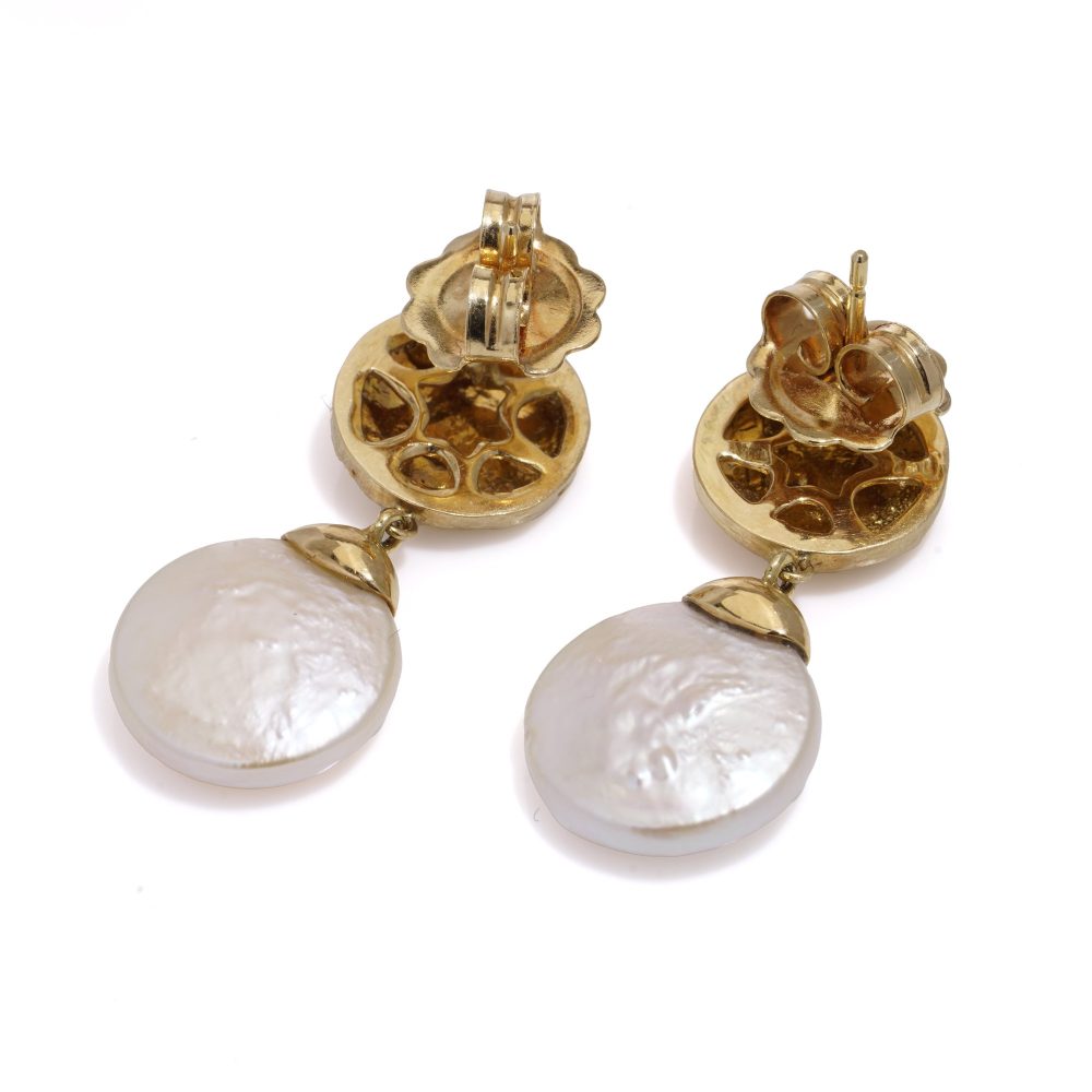 Freshwater pearl drop earrings in gold.