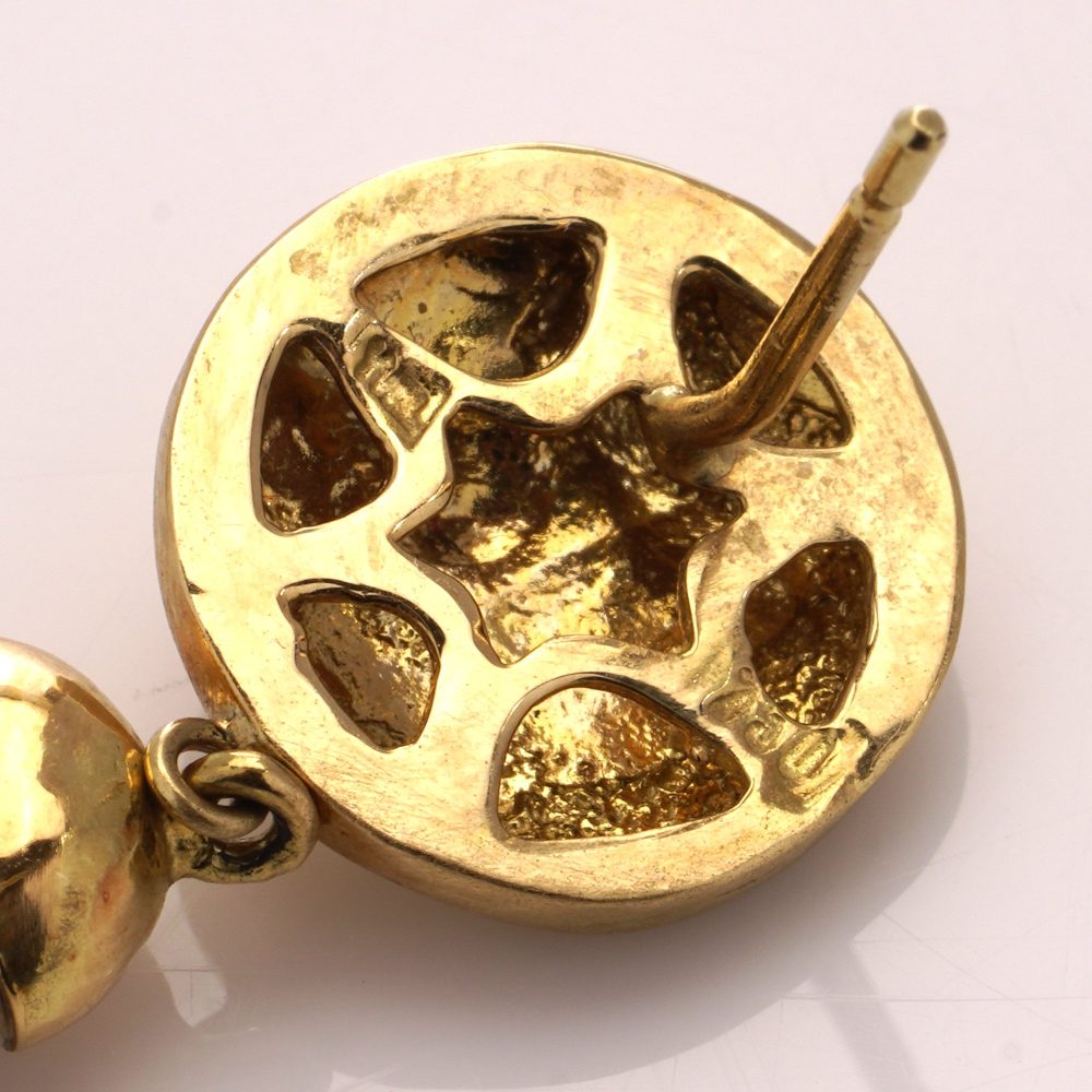 Freshwater pearl drop earrings in gold.