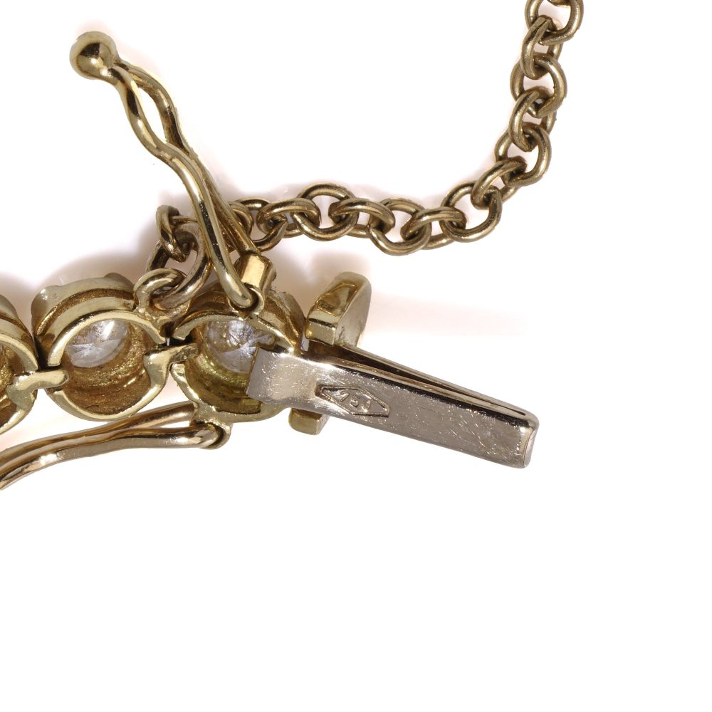 Gold tennis bracelet set with 6.30 carats of diamonds.