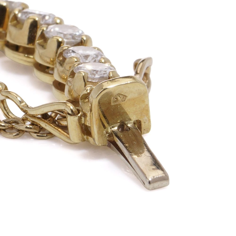 Gold tennis bracelet set with 6.30 carats of diamonds.