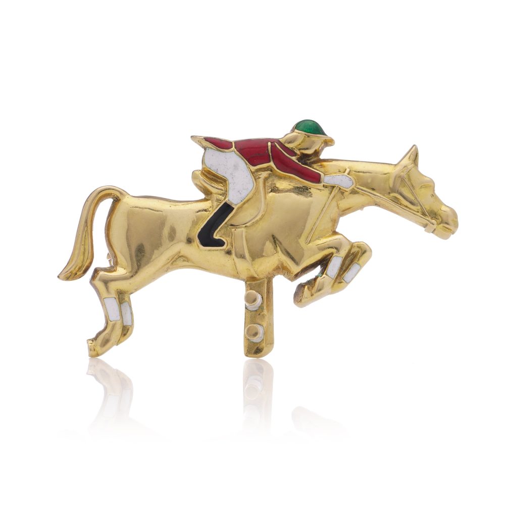 Jockey and horse brooch 18 carat gold and enamel.