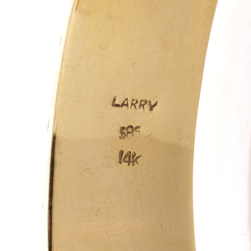 Larry dragon head gold bangle with diamonds, emeralds, and rubies.