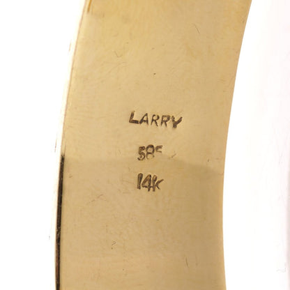 Larry dragon head gold bangle with diamonds, emeralds, and rubies.