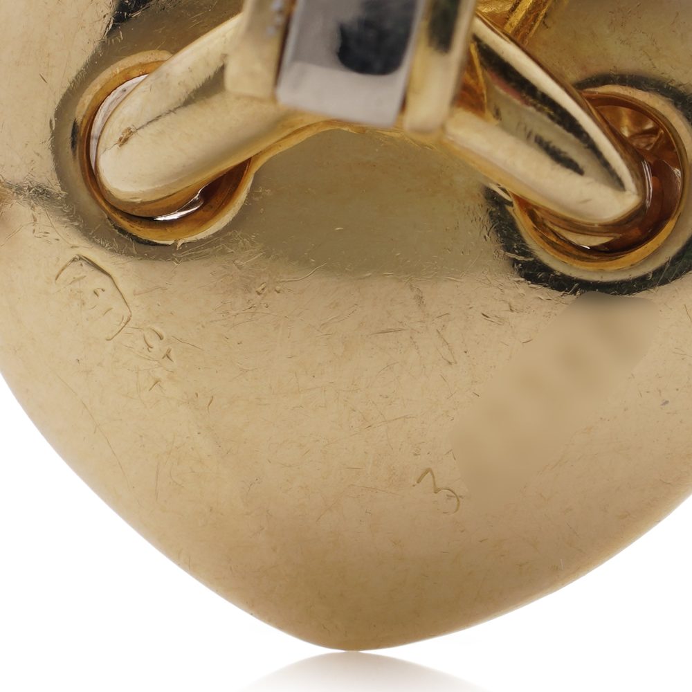 Chaumet gold heart-shaped clip earrings with X design set with diamonds.