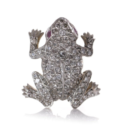 An Edwardian frog brooch in gold and silver set with diamonds and rubies.