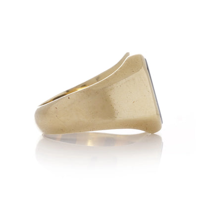 A yellow gold ring turned to the side, on a white background