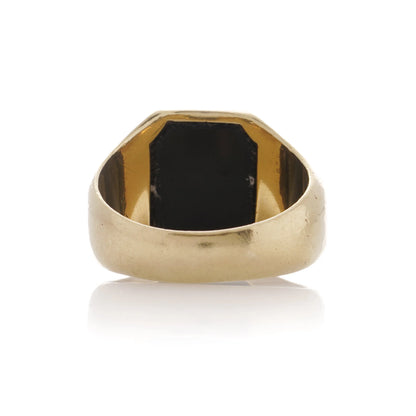 A yellow gold ring from behind, on a white background