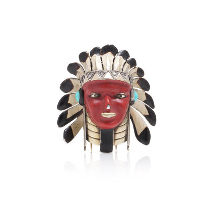 Cartier brooch in gold, silver and enamel set with gem.