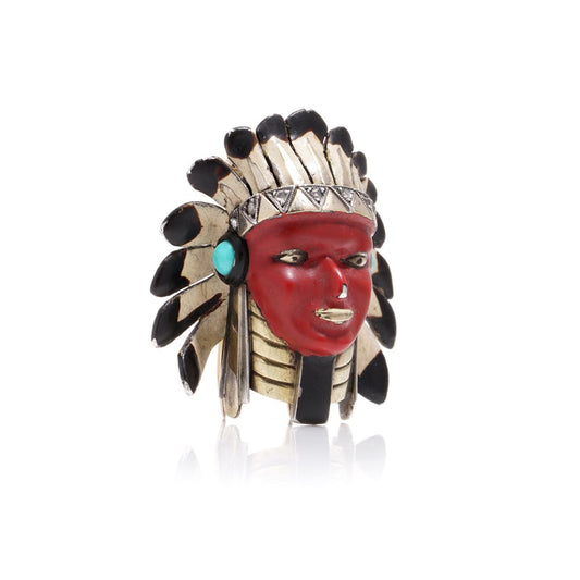 Cartier brooch in gold, silver and enamel set with gem.