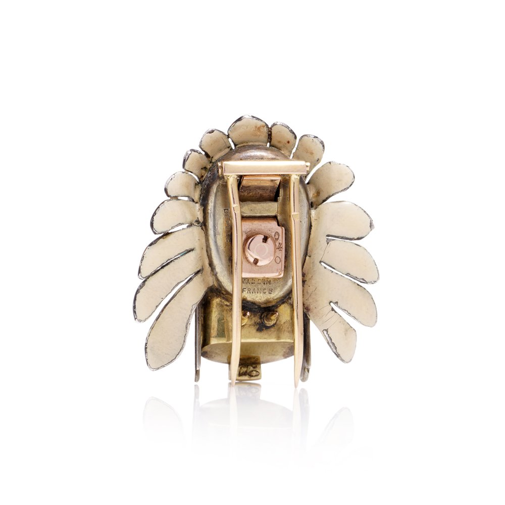 Cartier brooch in gold, silver and enamel set with gem.