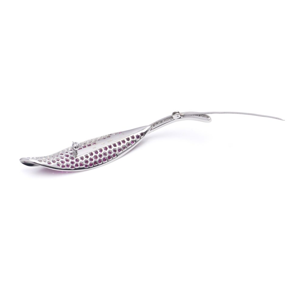 Vintage leaf-shaped brooch with rubies and diamonds in white gold.