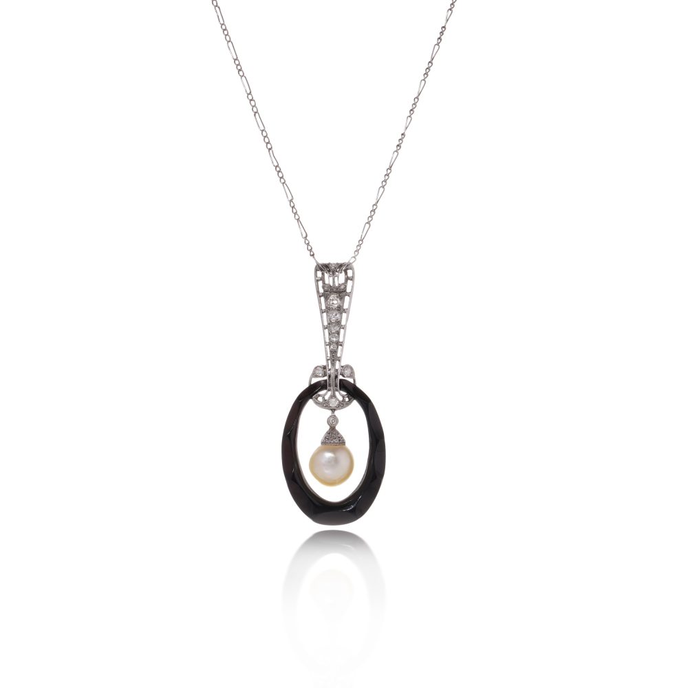 Antique platinum pendant necklace with pearl, onyx, and diamonds.
